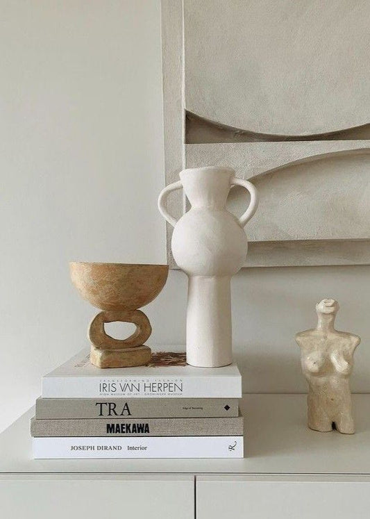 Decorative books on a window sill adding charm to a small space