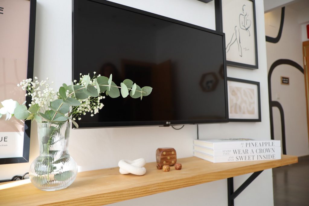 Use decorative books to organize your workspace. Place them vertically or horizontally to add visual interest and keep important documents within reach.